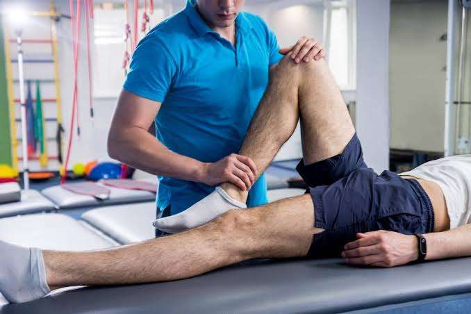 Certified physiotherapist providing treatment at home
